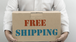 man holding box displaying free shipping